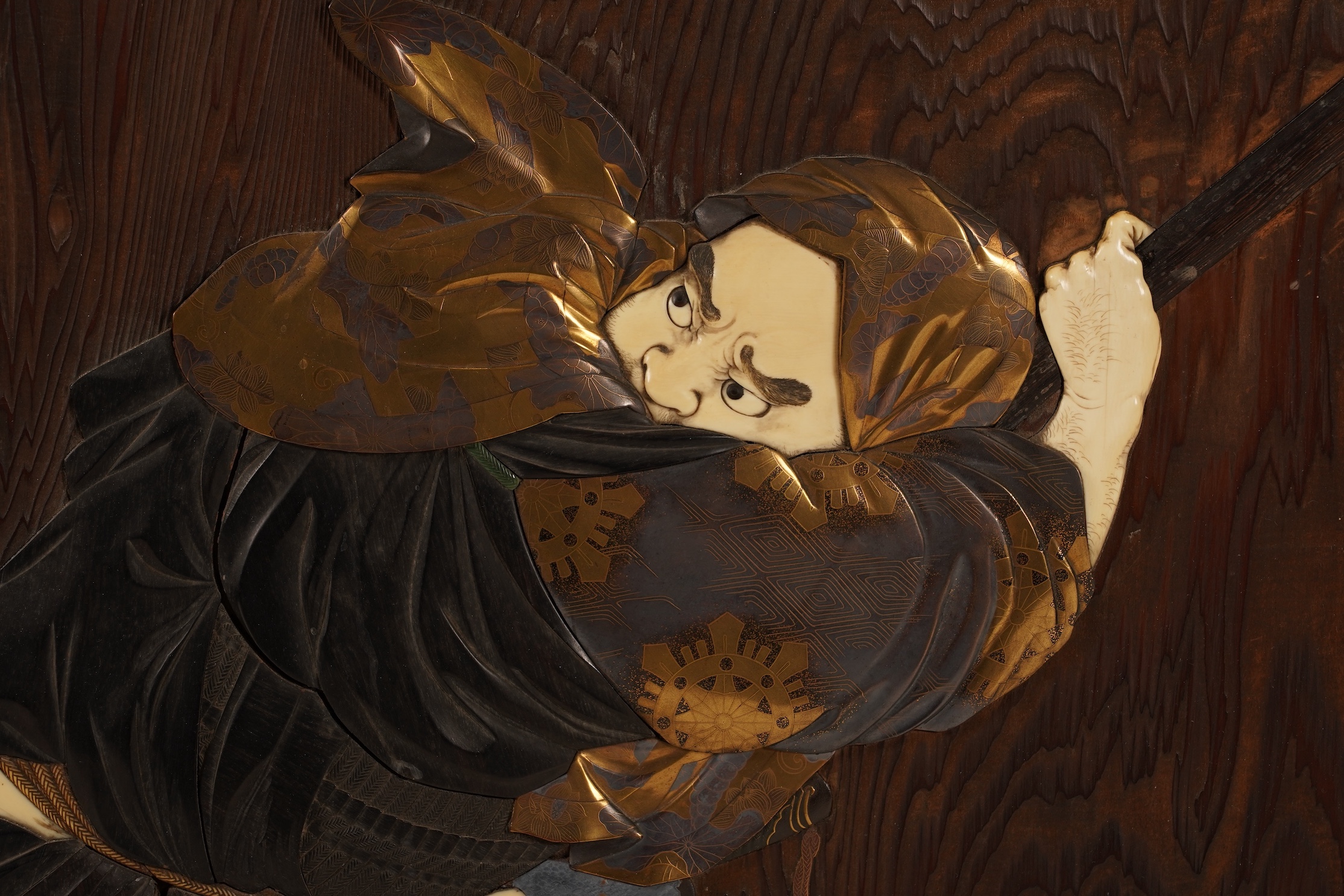 A Japanese inlaid persimmon wood tsuitate screen panel, Meiji period, possibly Tokyo School